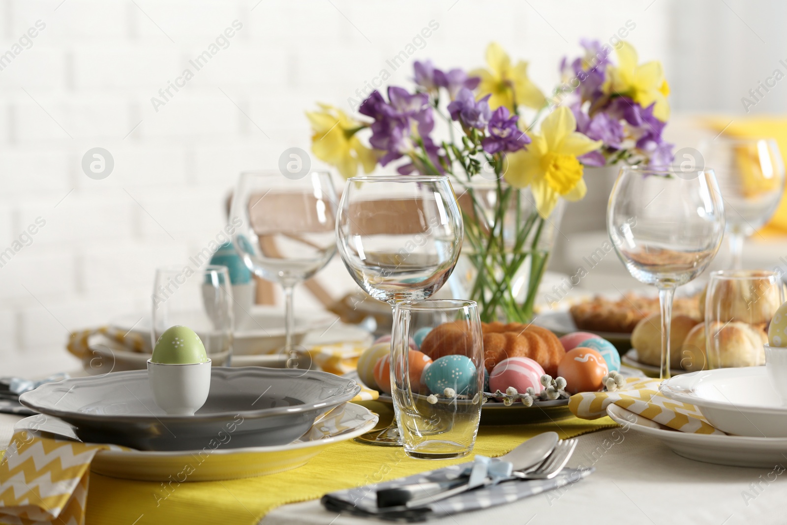 Photo of Festive Easter table setting with traditional meal at home