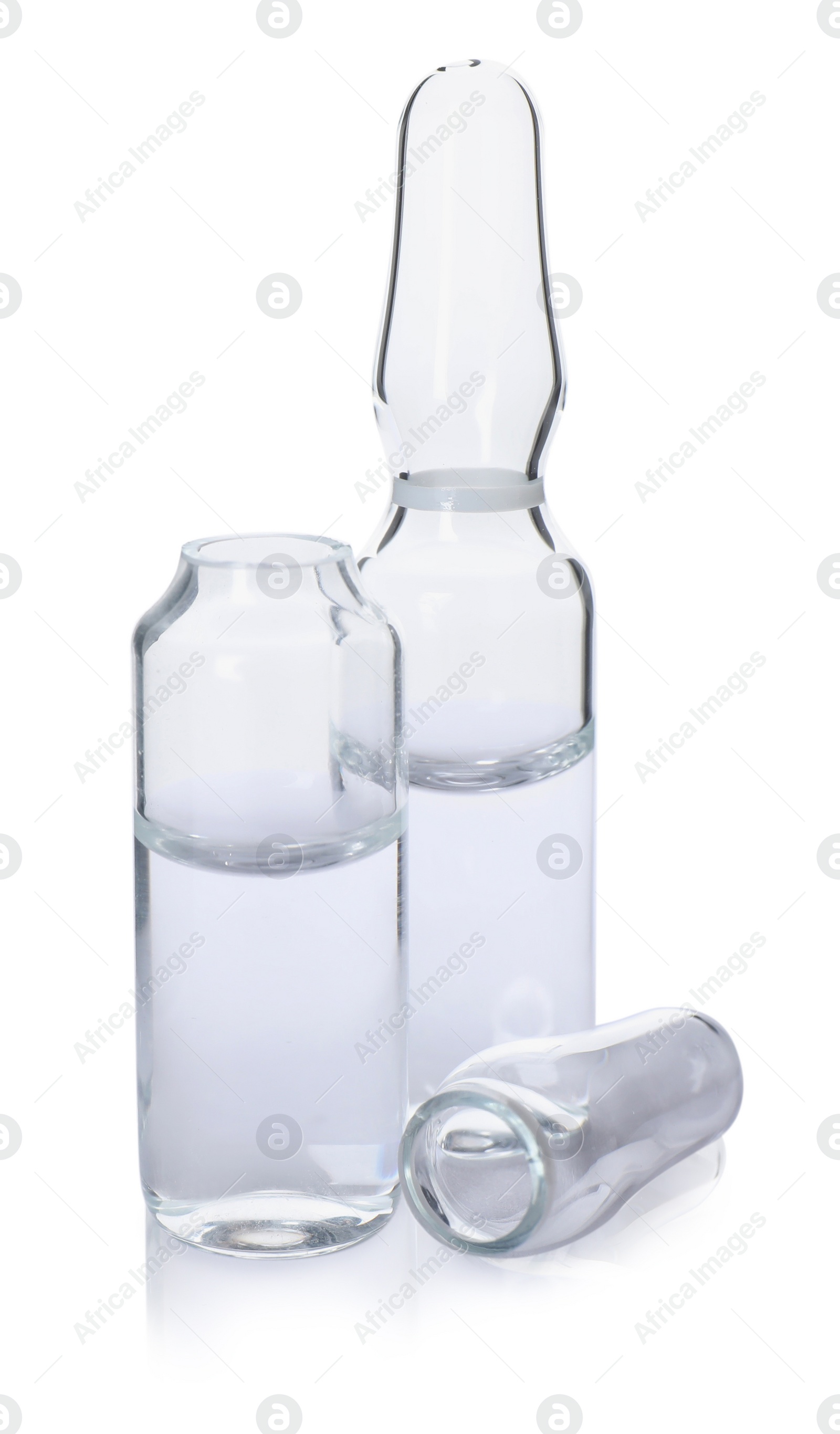 Photo of Glass ampoules with medication on white background