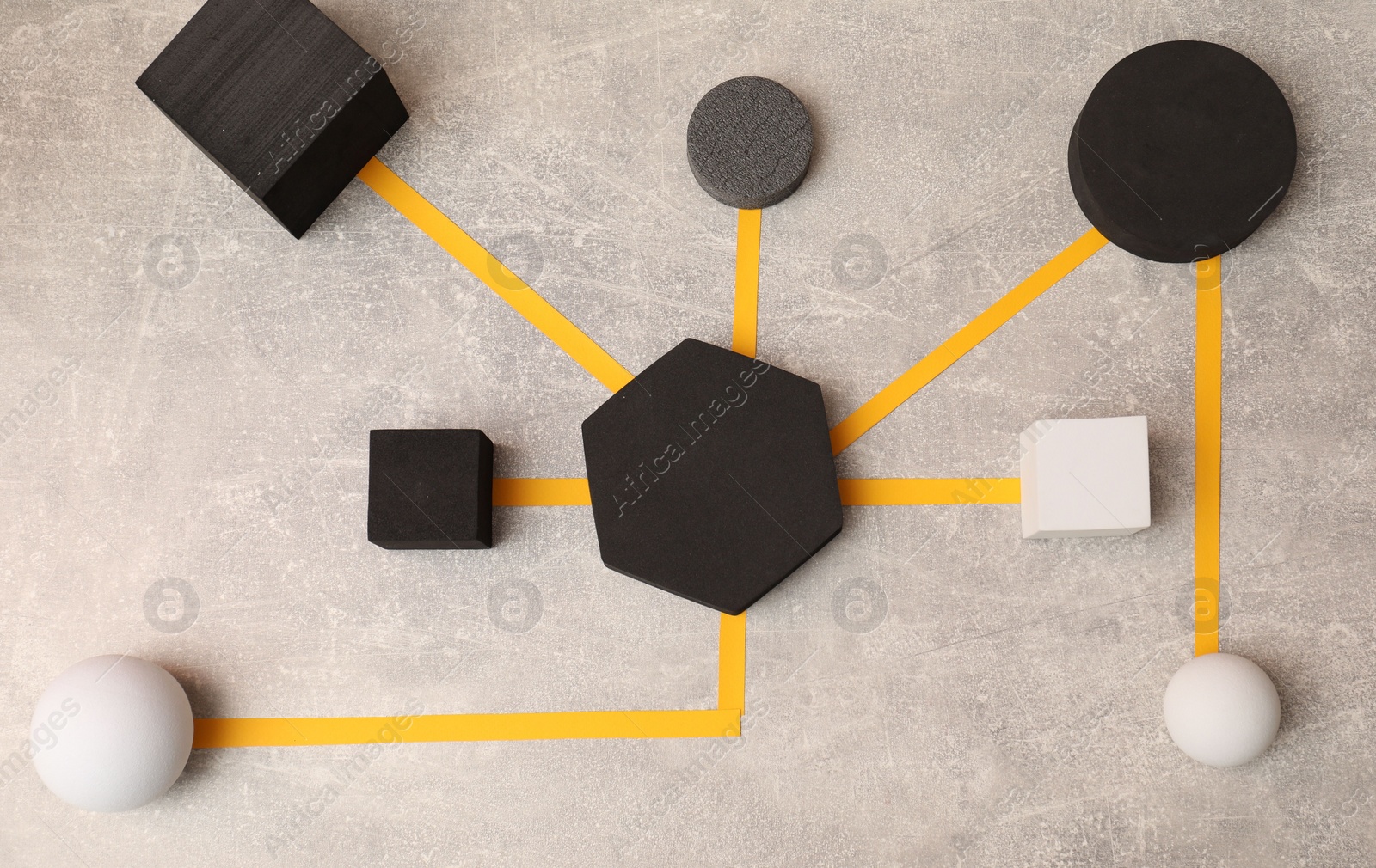 Photo of Business process organization and optimization. Scheme with geometric figures on light grey table, top view