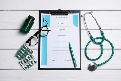 Photo of Flat lay composition with medical prescription form on white wooden table