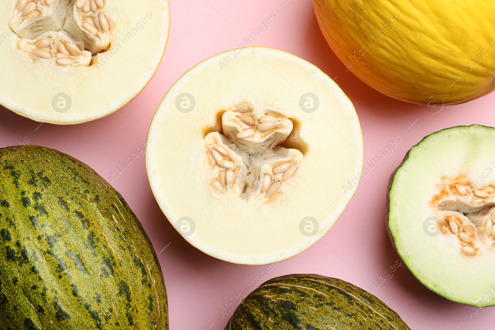 Photo of Flat lay composition with tasty melon on pink background