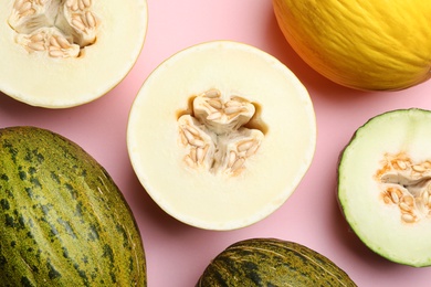 Photo of Flat lay composition with tasty melon on pink background