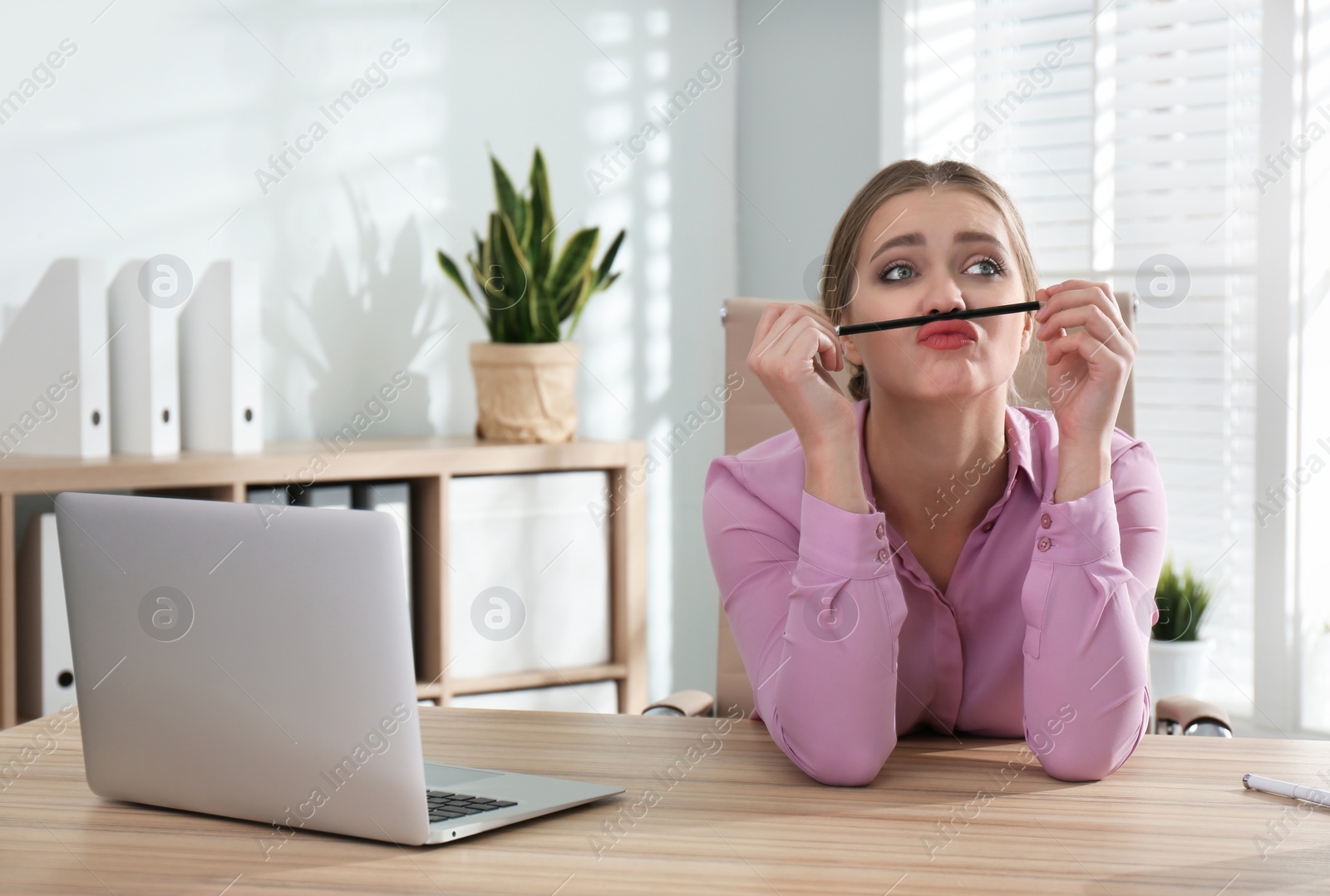 Photo of Lazy worker at wooden desk in office