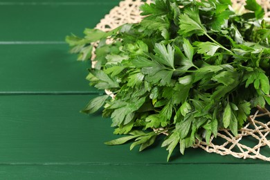 Fresh green parsley on wooden table, closeup. Space for text