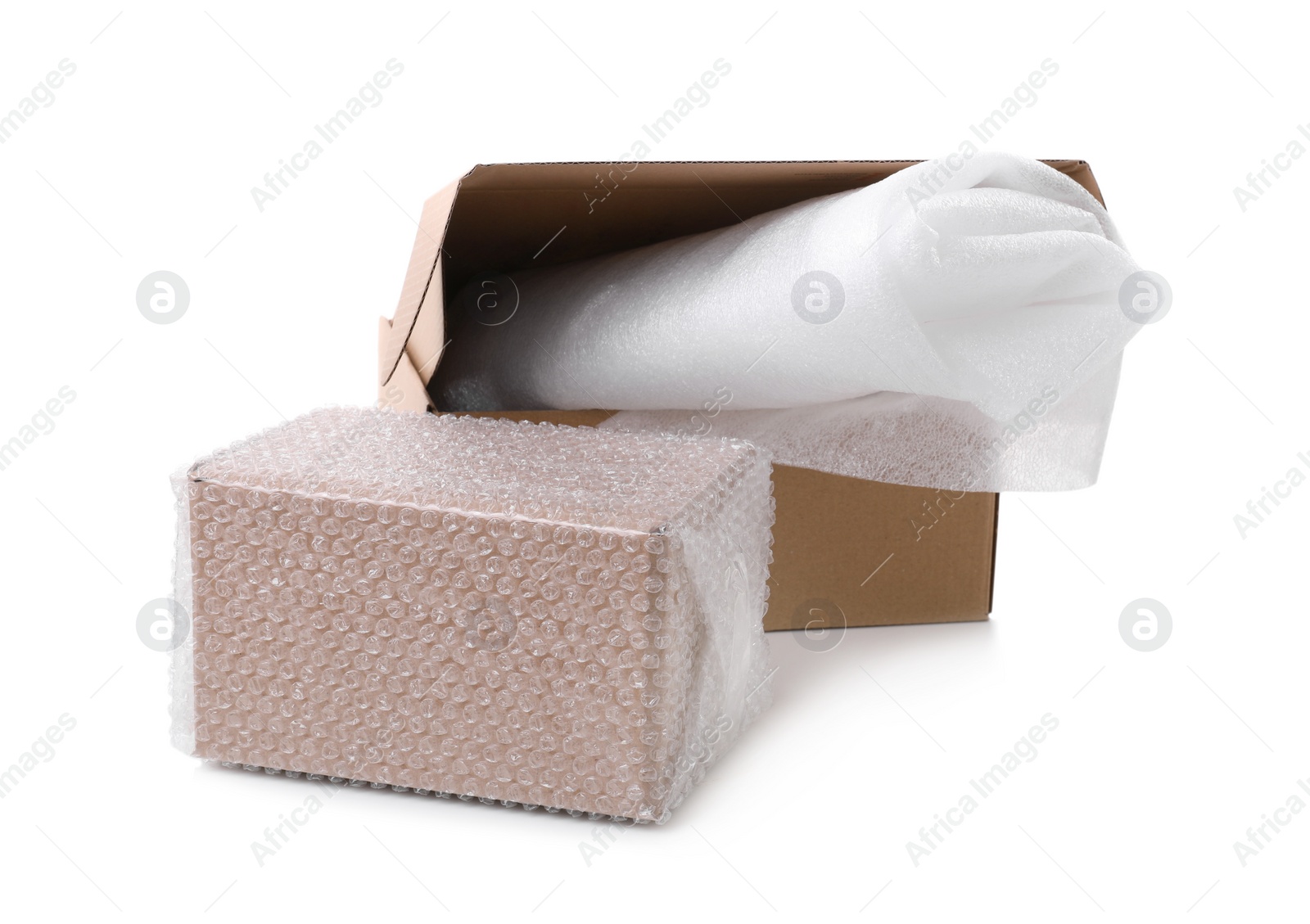 Photo of Cardboard boxes with bubble wrap and packaging foam on white background