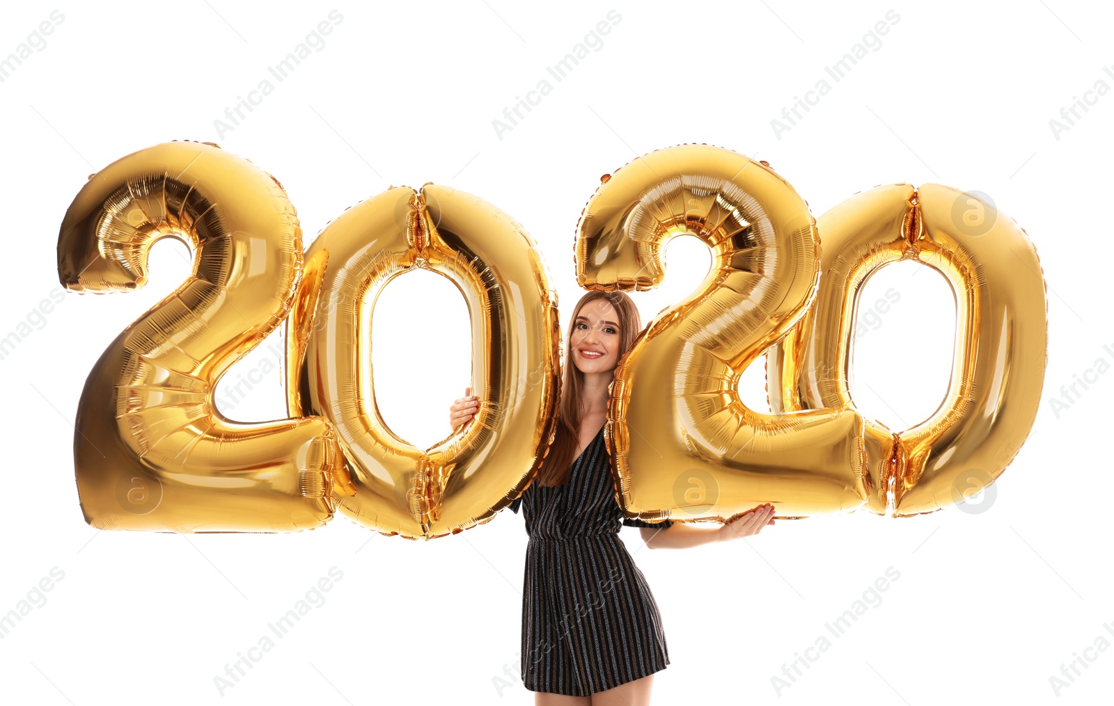 Photo of Happy young woman with golden 2020 balloons on white background. New Year celebration