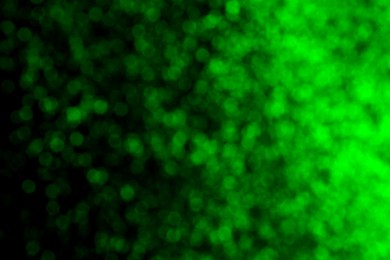 Image of St. Patrick day. Background with blurred green lights, bokeh effect