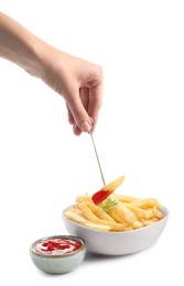 Photo of Woman dipping french fries into ketchup on white background, closeup