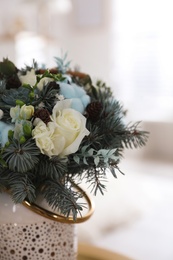 Photo of Beautiful wedding winter bouquet indoors, closeup view
