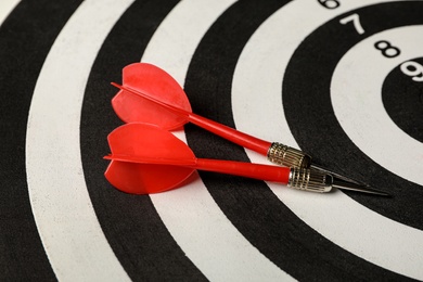 Photo of Red arrows on dart board, closeup view