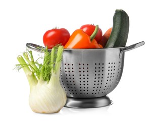 Colander with fresh vegetables isolated on white