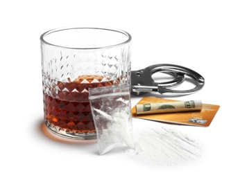 Photo of Composition with cocaine and glass of alcohol on white background