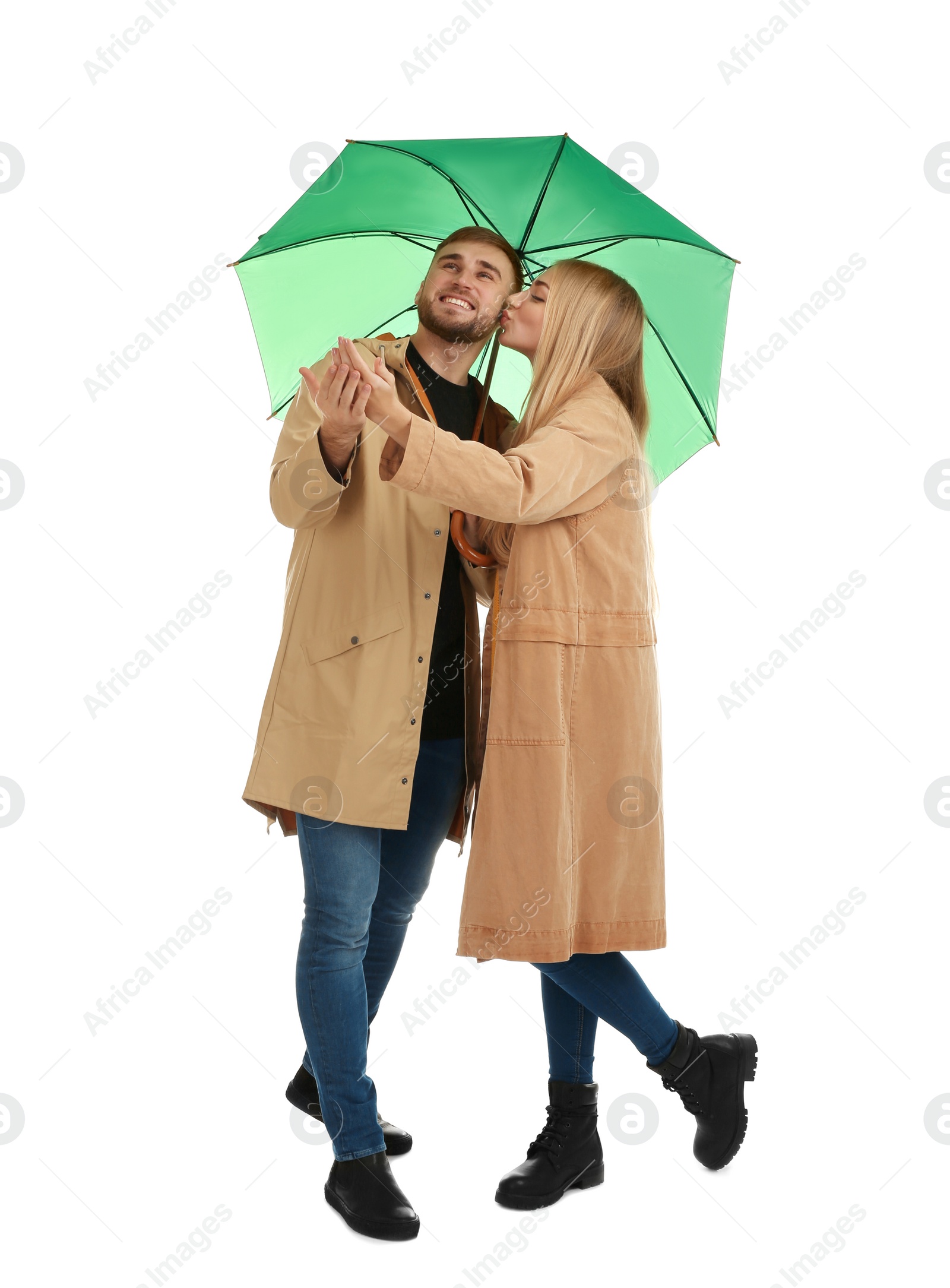 Photo of Full length portrait of beautiful couple with umbrella, isolated on white