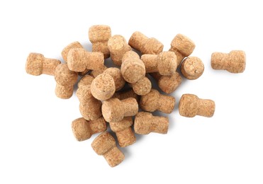 Photo of Heap of sparkling wine corks on white background, top view