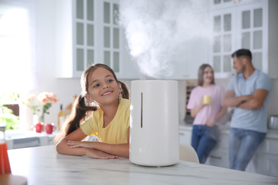 Photo of Family in kitchen with modern air humidifier