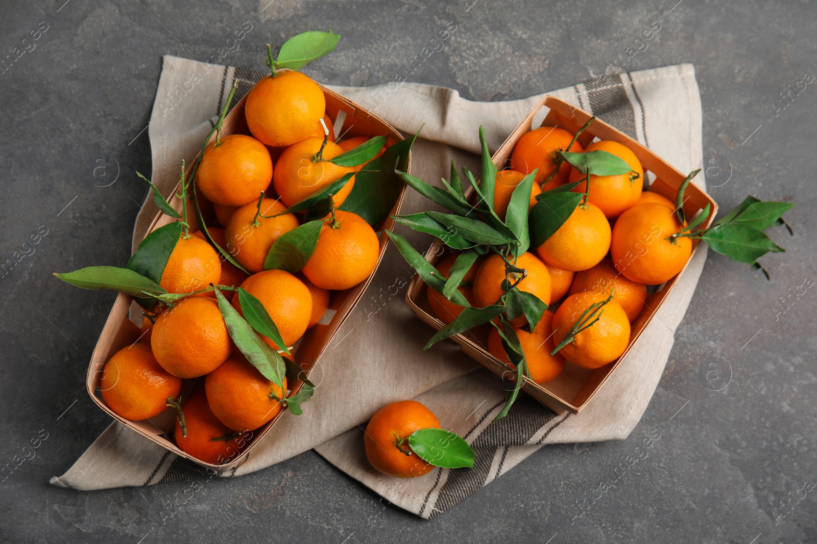 Photo of Flat lay composition with fresh ripe tangerines on grey background