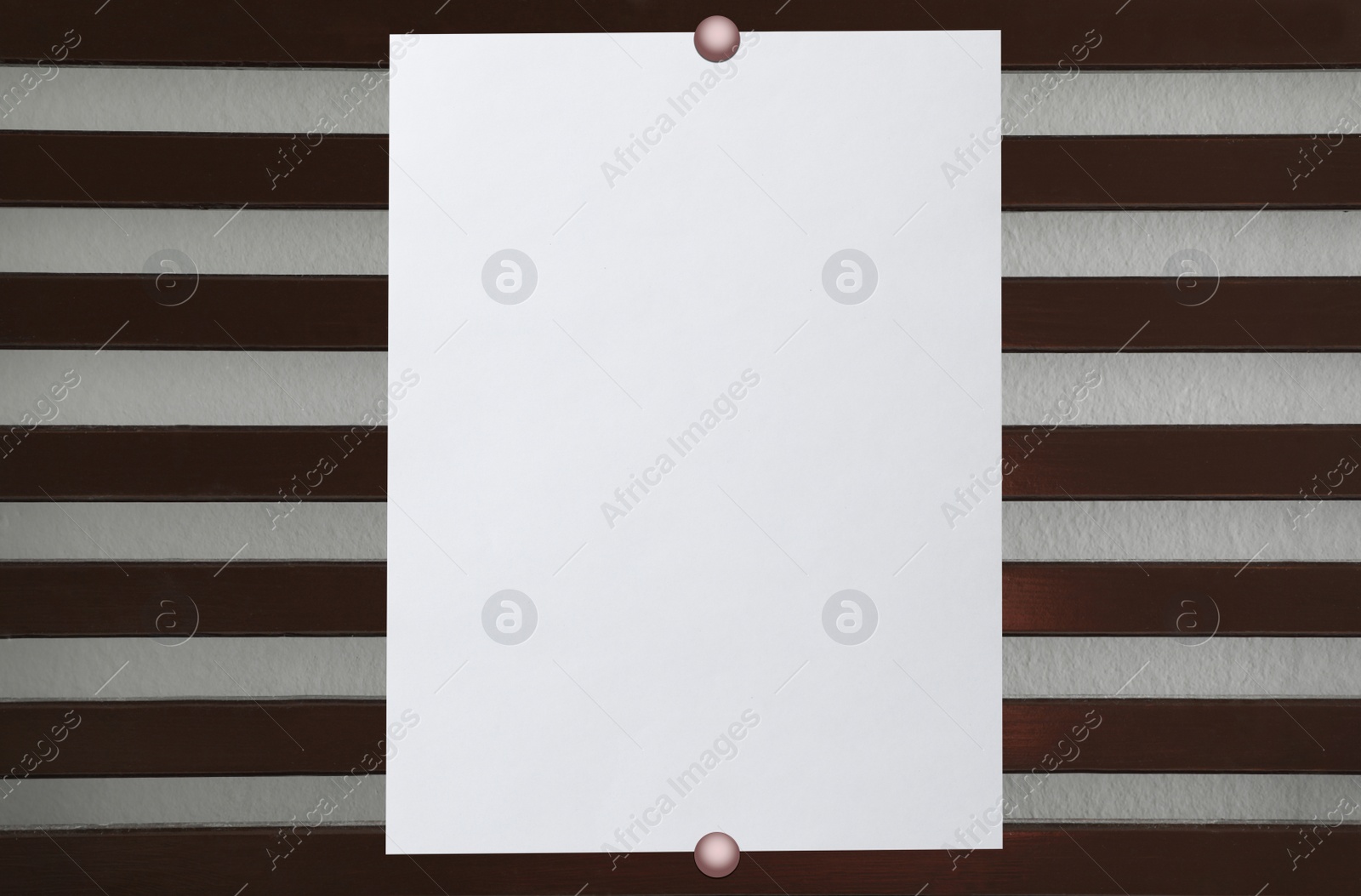 Image of Blank poster attached to striped wall. Space for design