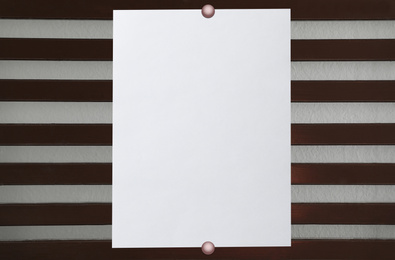 Image of Blank poster attached to striped wall. Space for design