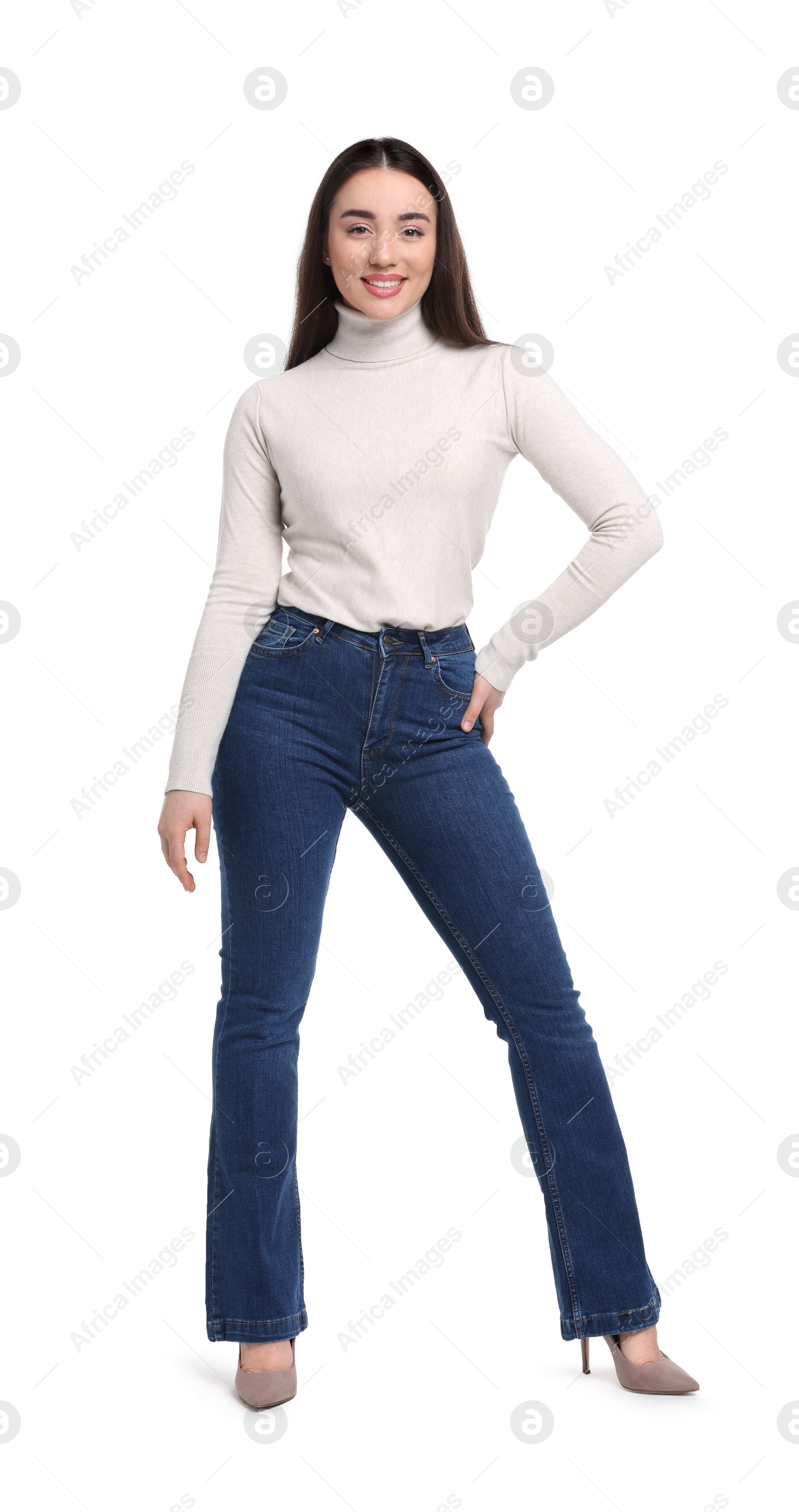 Photo of Young woman in stylish jeans on white background