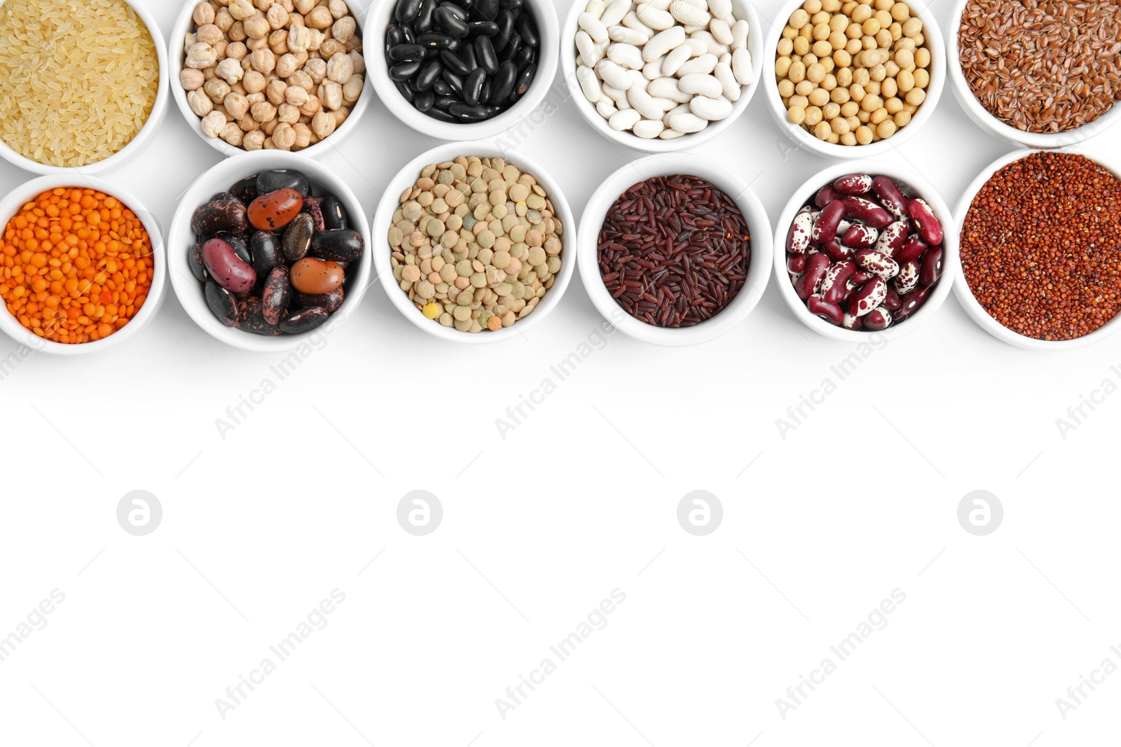 Photo of Various raw veggie seeds in bowls on white background, top view