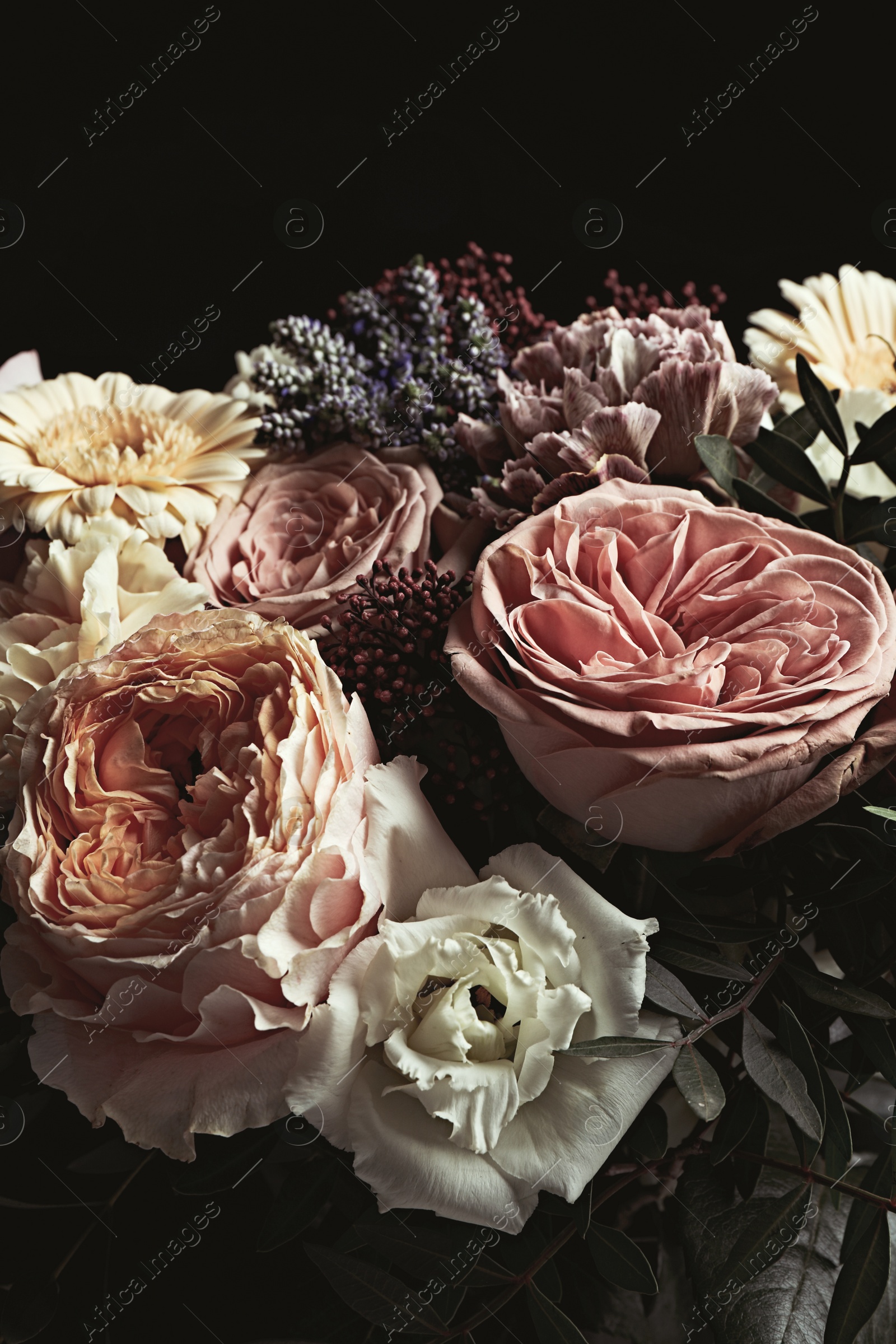 Photo of Beautiful bouquet on black background. Floral card design with dark vintage effect