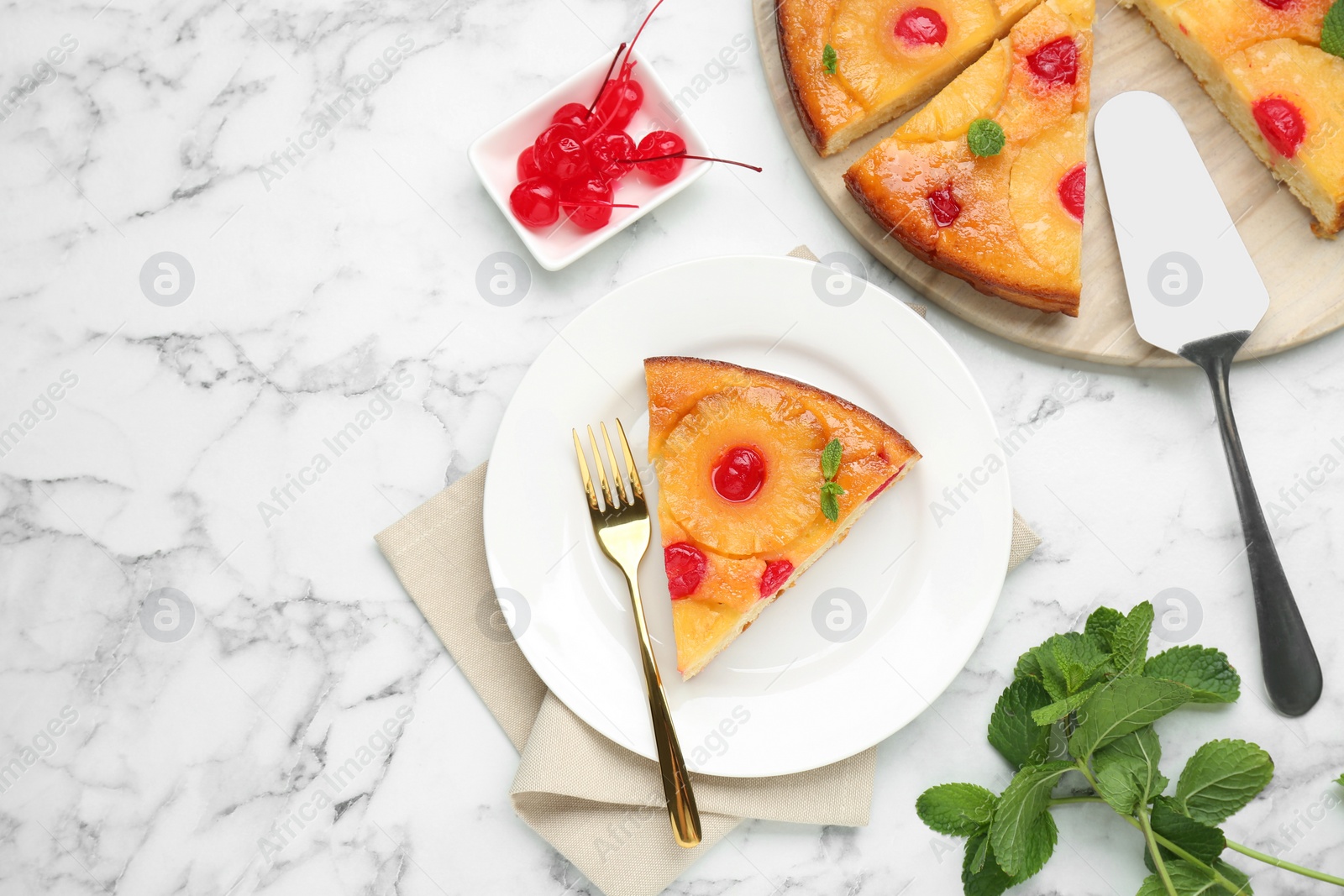 Photo of Delicious cut pineapple pie with cherry and mint on white marble table, flat lay. Space for text