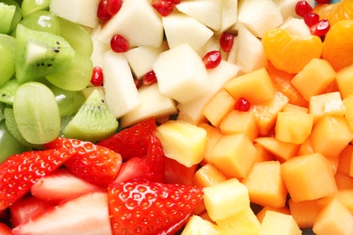 Photo of Different fresh cut fruits, closeup