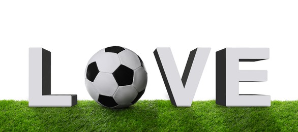 Image of Word LOVE made of letters and soccer ball on green grass against white background