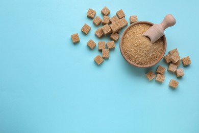 Different types of brown sugar on turquoise background, flat lay. Space for text