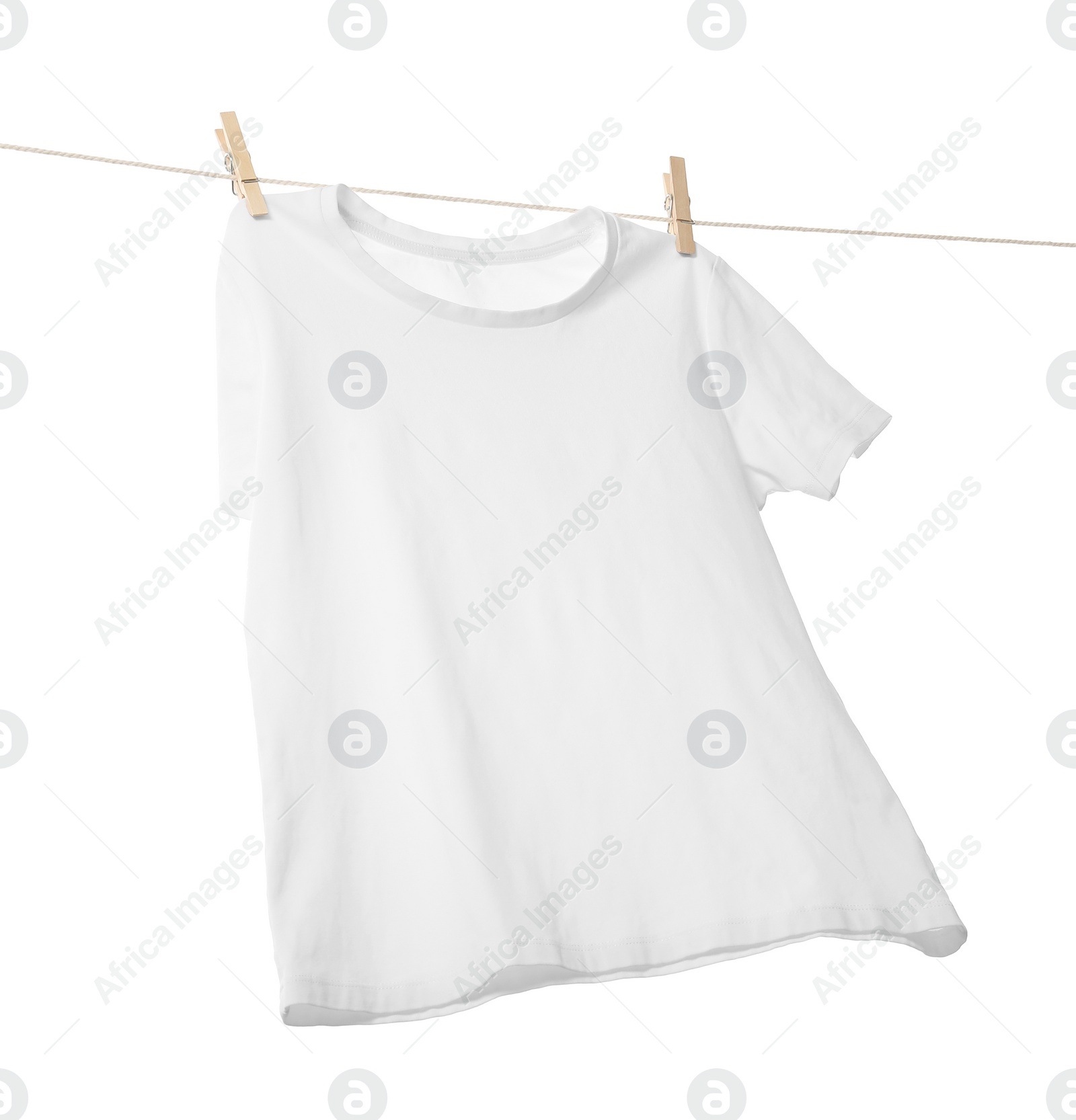 Photo of One t-shirt drying on washing line isolated on white, low angle view