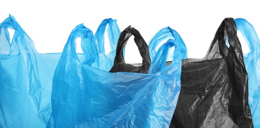 Photo of Many different plastic bags on white background