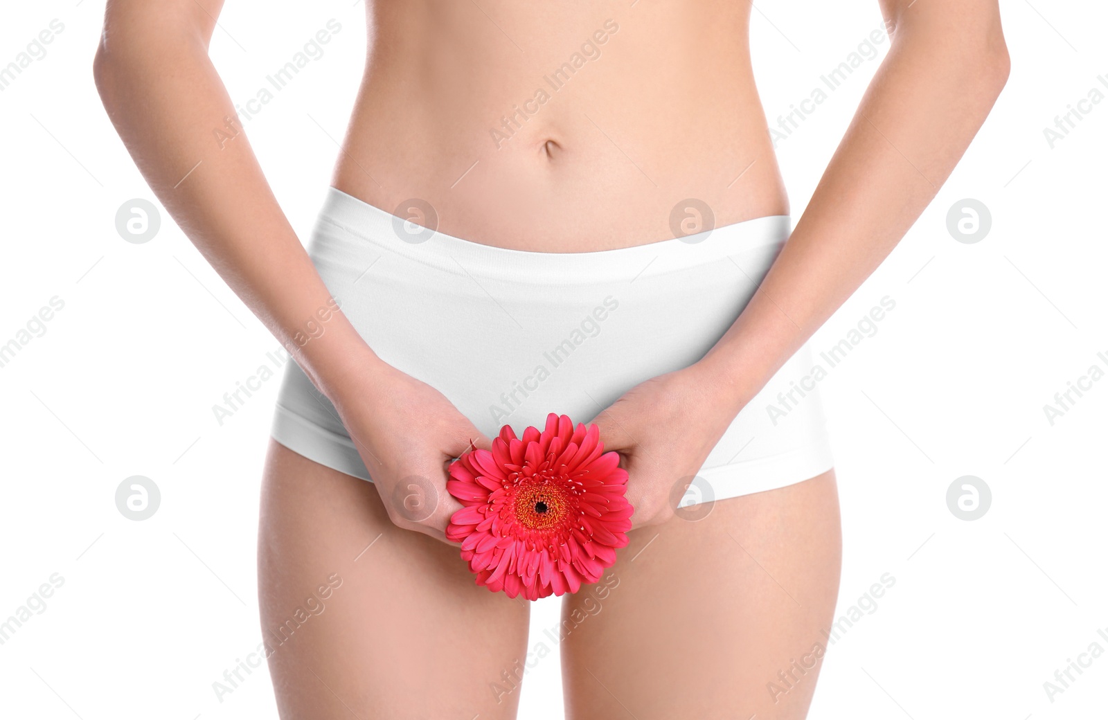 Photo of Young woman holding flower near underwear on white background. Gynecology