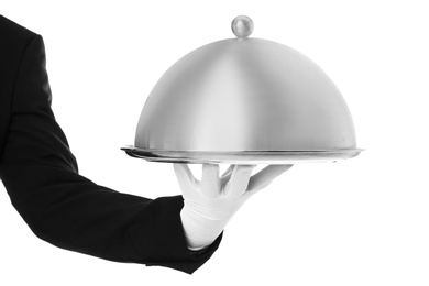 Waiter holding metal tray with lid on white background, closeup