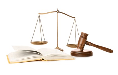 Photo of Wooden gavel, book and scales of justice on white background