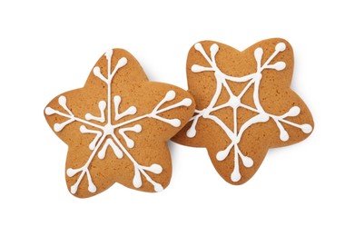 Photo of Tasty star shaped Christmas cookies with icing isolated on white, top view