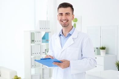 Photo of Young male receptionist working in hospital