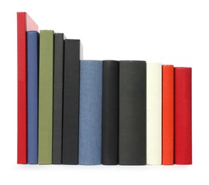 Photo of Many different hardcover books on white background