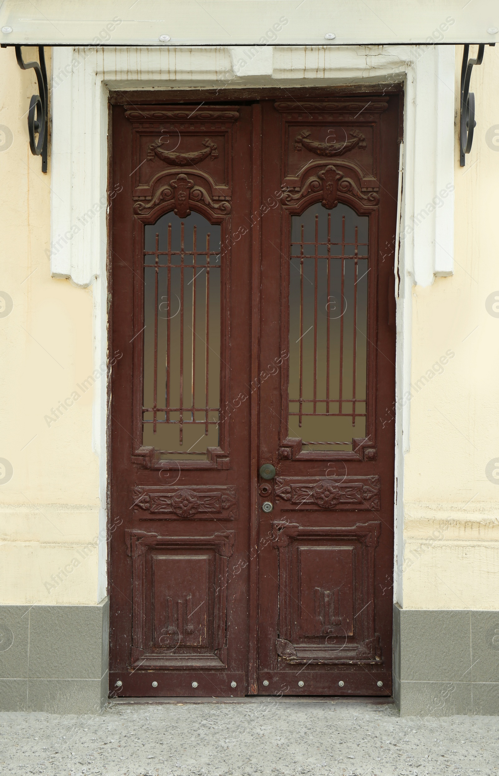 Photo of Closed vintage wooden door in old building