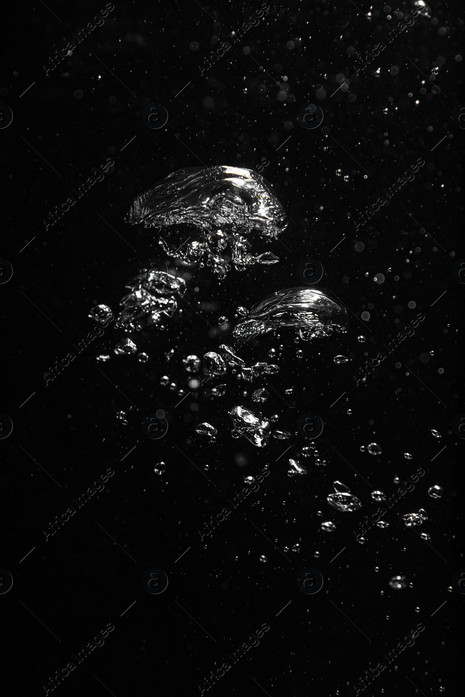 Photo of Air bubbles in water on black background