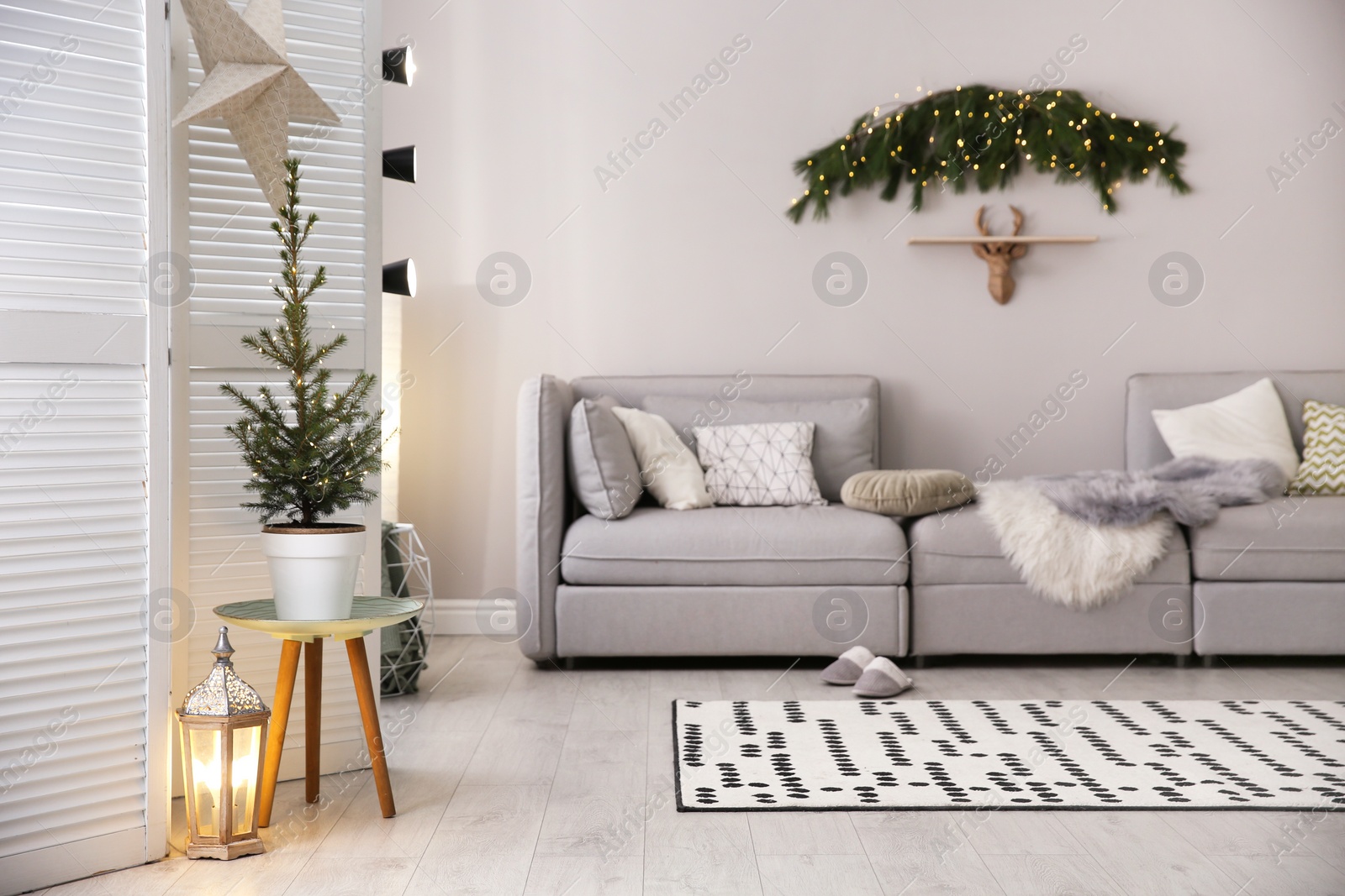 Photo of Stylish living room with Christmas decorations. Interior design