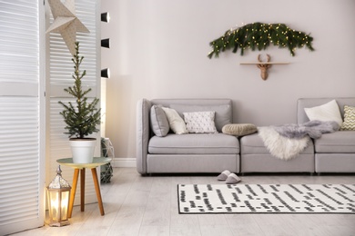 Stylish living room with Christmas decorations. Interior design