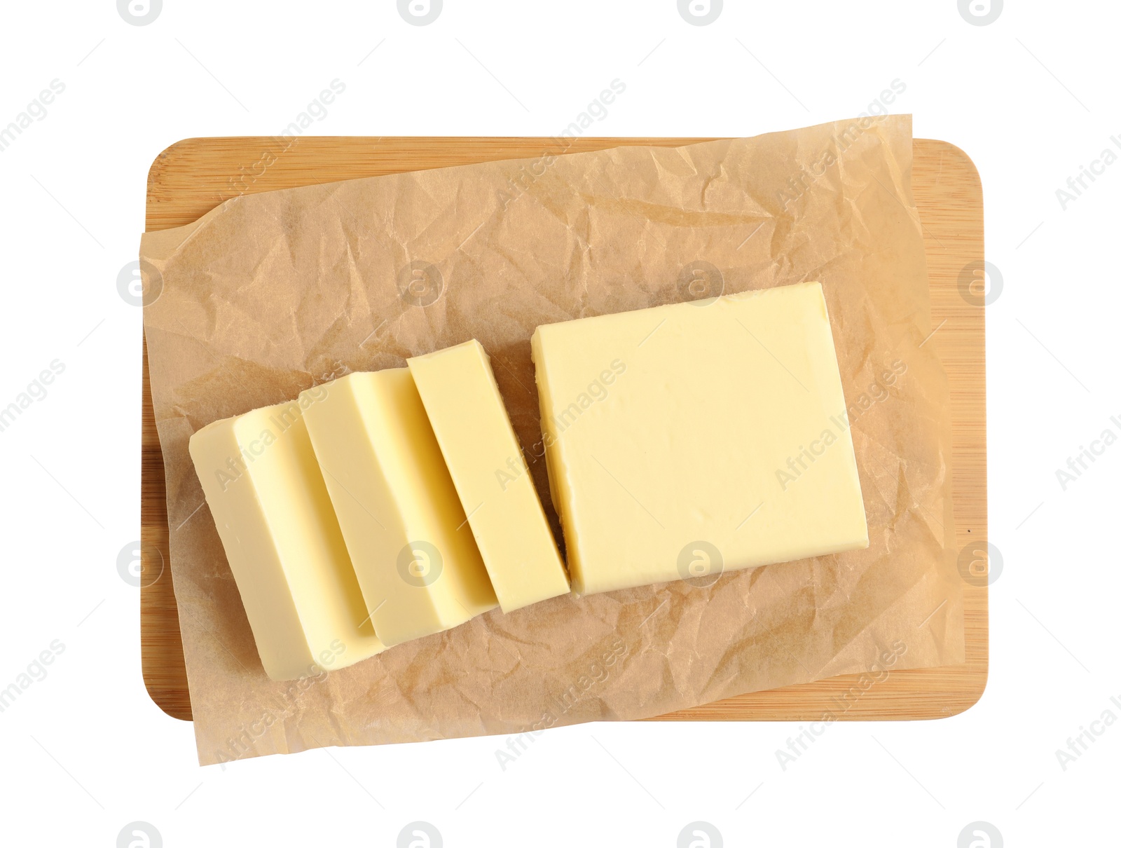 Photo of Wooden board with cut block of butter on white background, top view