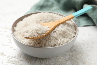 Raw basmati rice on white table, closeup