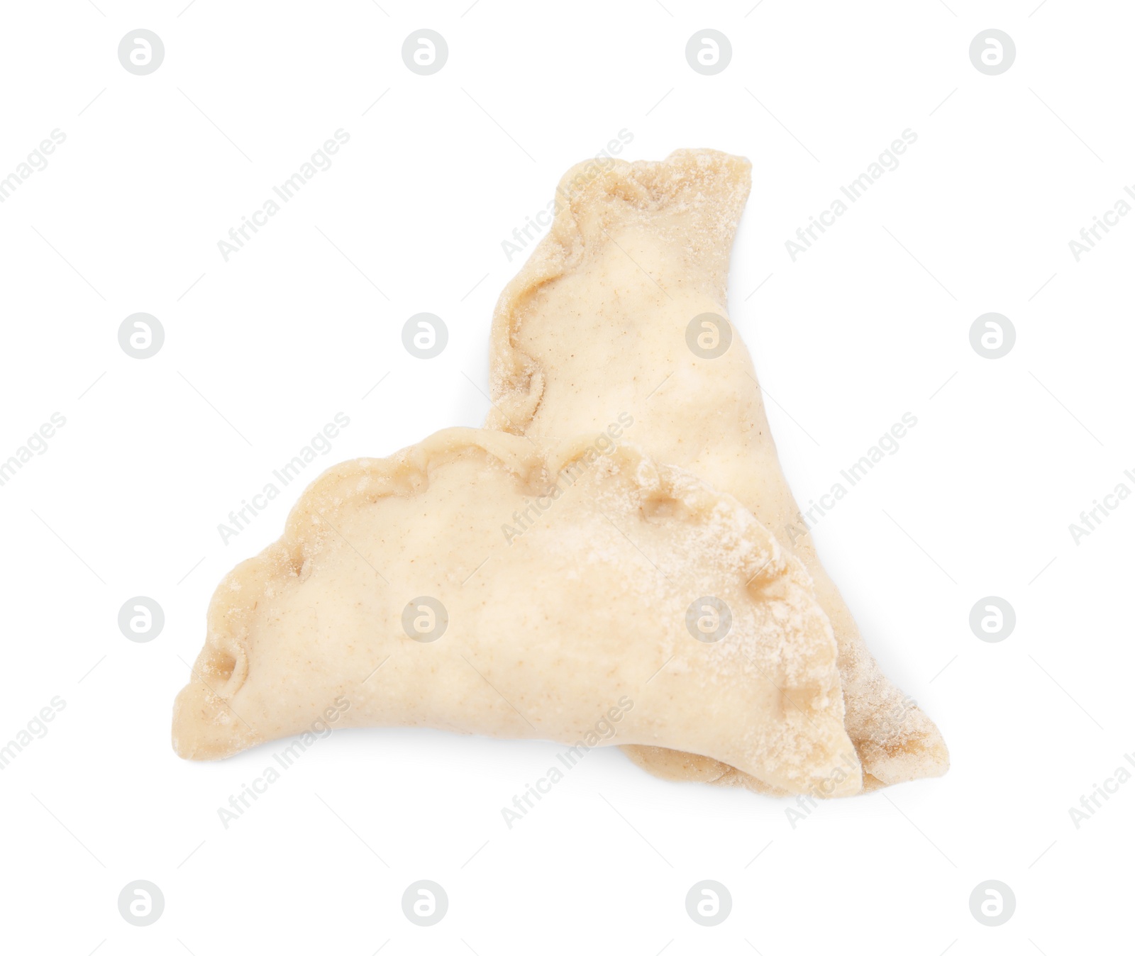 Photo of Raw dumplings (varenyky) with cottage cheese isolated on white, top view