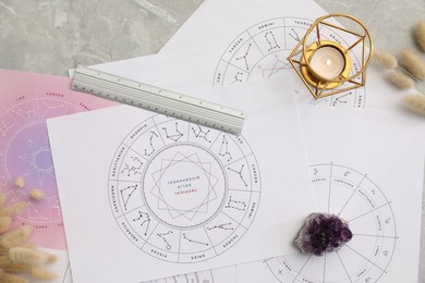Zodiac wheels for making forecast of fate and astrological items for fortune telling on table, flat lay