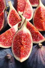 Photo of Fresh ripe fig slices, closeup. Tropical fruit