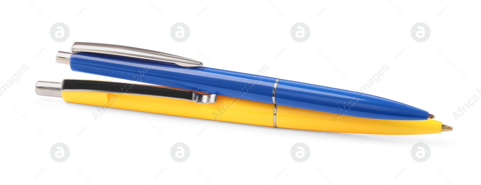 Photo of New stylish blue and yellow pens isolated on white