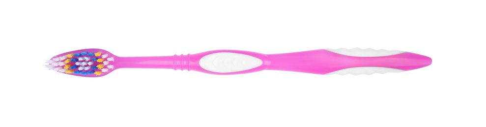 Photo of Pink plastic toothbrush isolated on white, top view