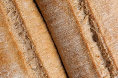 Photo of Crispy ciabattas as background, closeup. Fresh bread