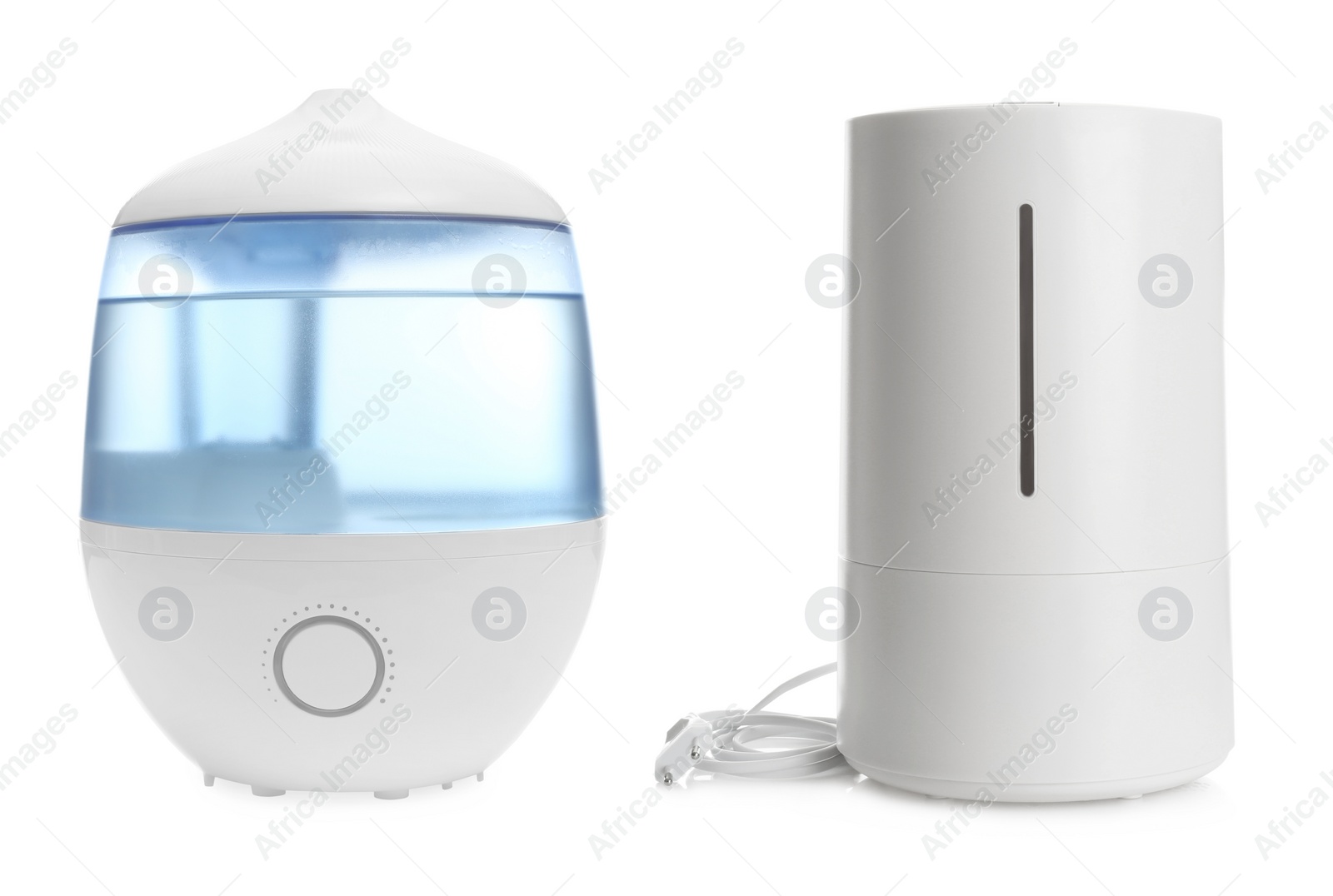 Image of Two modern air humidifiers on white background